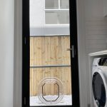 Pet door in glass door of laundry