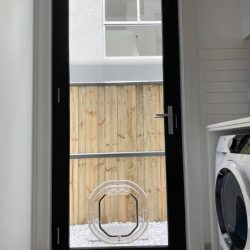 Pet door in glass door of laundry